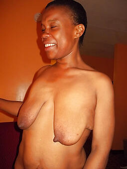 ebony woman with saggy tits during a sexy striptease